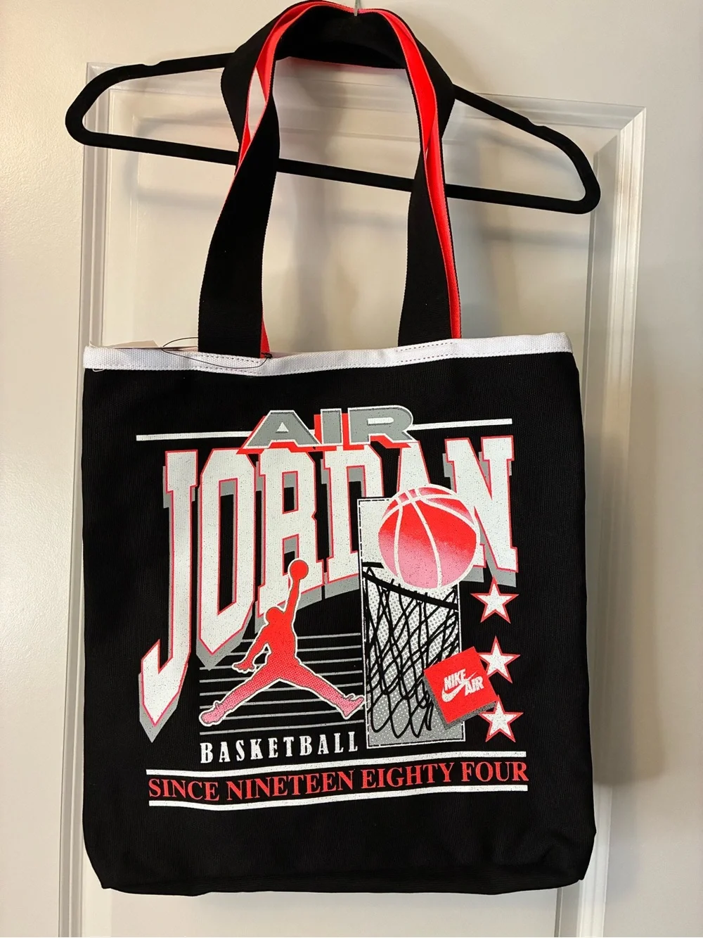 New Jordan Brand Jam 84 Tote bag in black and infrared